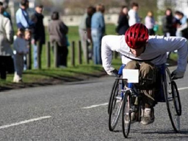 A disabled person competing in a wheelchair competition